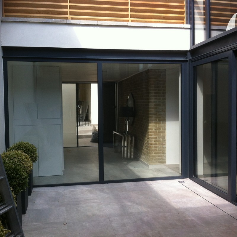 Floor-to-ceiling sliding doors opening to courtyard in St John's Wood